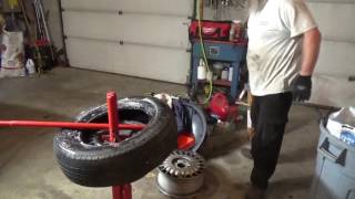 Changing a tire with a manual tire changer Is it worth it [upl. by Analat]